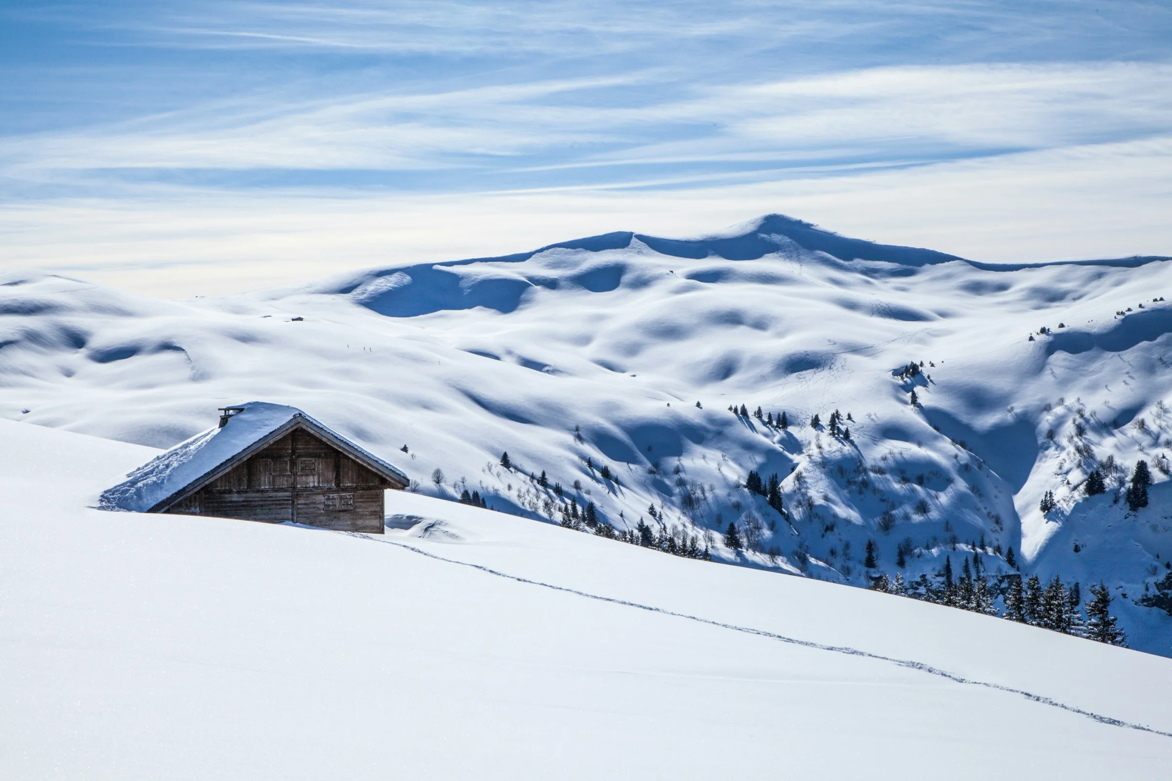 Snow-covered peaks at first light — ski week in the Alps