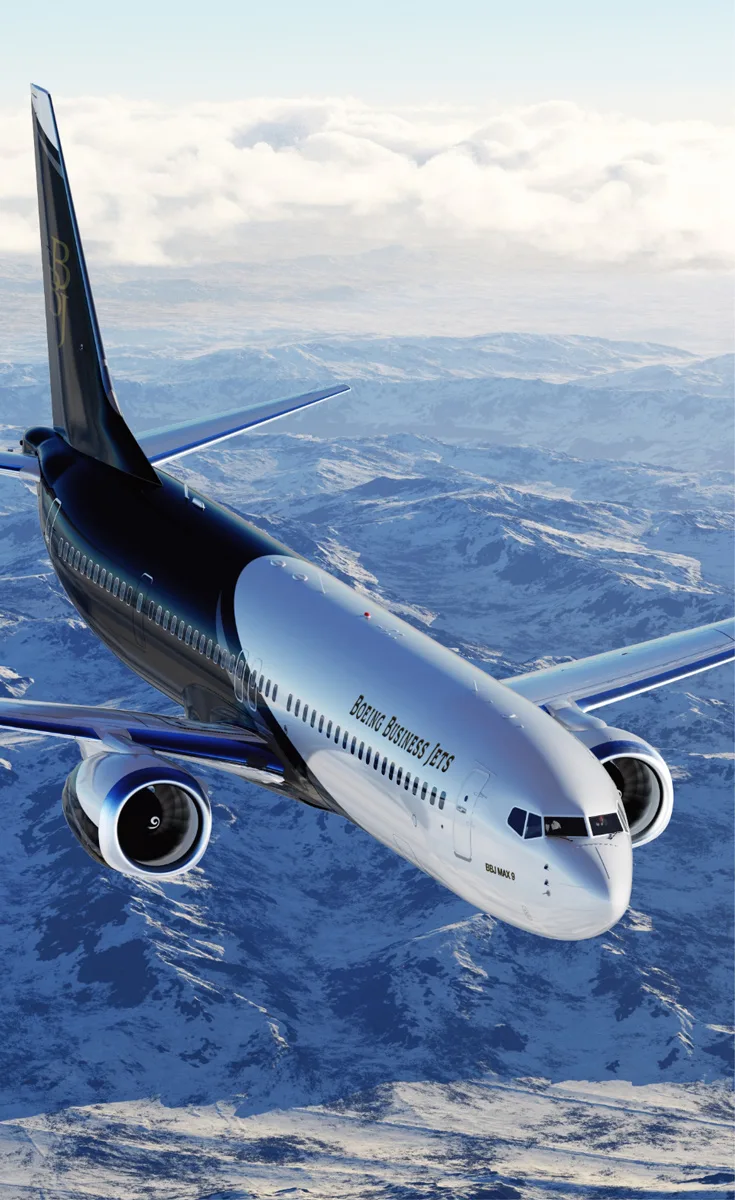 BBJ MAX exterior over mountains
